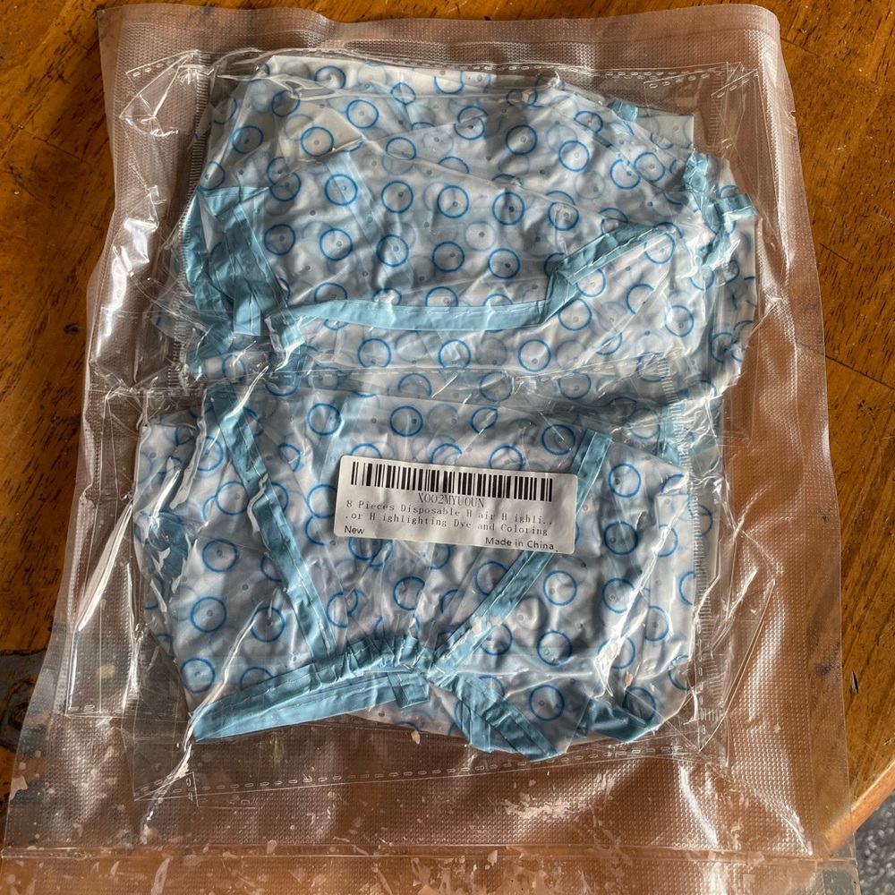 Eight piece disposable hair dye caps + 4 hooks